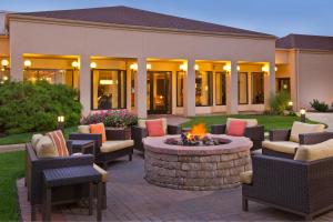 a patio with chairs and a fire pit in a yard at Courtyard by Marriott Mt. Laurel in Mount Laurel