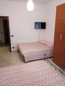 Postel nebo postele na pokoji v ubytování Casa Piacquadio