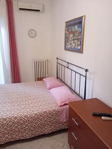 Postel nebo postele na pokoji v ubytování Casa Piacquadio