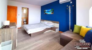 A bed or beds in a room at Arode Villa Dionysus