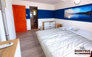 A bed or beds in a room at Arode Villa Dionysus
