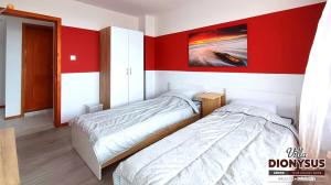 A bed or beds in a room at Arode Villa Dionysus