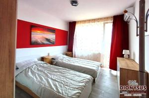 A bed or beds in a room at Arode Villa Dionysus