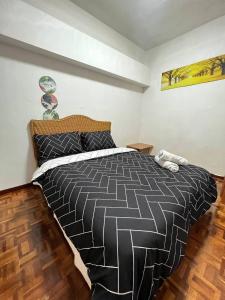 Un ou plusieurs lits dans un hébergement de l'établissement Cozy 2 Bedroom @ Homey Homes