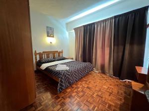 Un ou plusieurs lits dans un hébergement de l'établissement Cozy 2 Bedroom @ Homey Homes