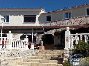 a building with stairs in front of a building at Rincón De Pepe in El Castell de Guadalest