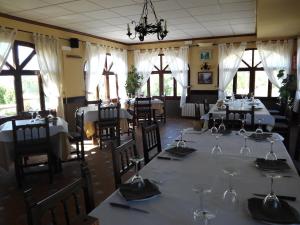 a dining room with a table with wine glasses on it at Rincón De Pepe in El Castell de Guadalest