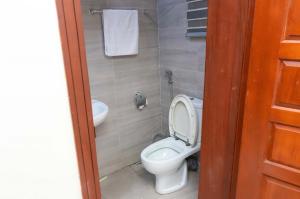 a bathroom with a toilet and a sink at Rufus Lanre Laniyan in Lagos