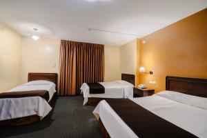 Postel nebo postele na pokoji v ubytování Cesar´s Hotel La Merced