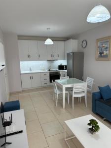 A kitchen or kitchenette at Merville Apartment 3