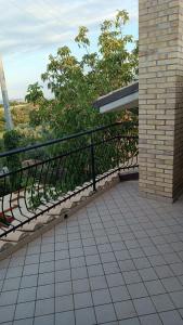 a balcony with a black railing on a building at B&B "LE LUCI" SUPER CAMERA IN ATTICO interno 3 in Vasto
