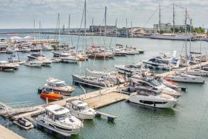 a bunch of boats are docked in a marina at Little Monaco - Yacht Park in Gdynia