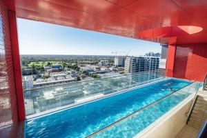 a swimming pool on the roof of a building at Sky High on Grote - An Elevated Inner-City Stay in Adelaide