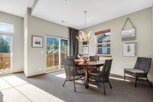 a dining room with a table and chairs at Tumwater Vista Retreat, Unit 903 in Leavenworth