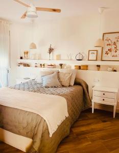 a bedroom with a large bed in a room at Vivienda de lujo a 100 metros de la playa in La Antilla