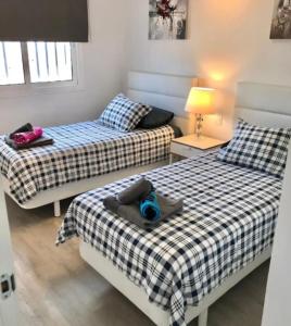 A bed or beds in a room at 2 Bedroom Apartment