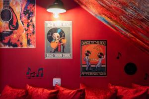 a bedroom with posters on the wall and a bed at Baila Casa in Nottingham +42 photos