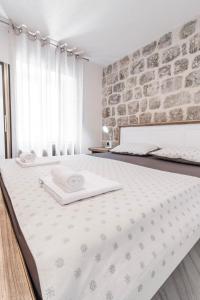 Postel nebo postele na pokoji v ubytování Apartments Florian