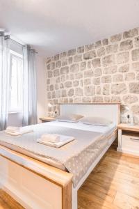 Postel nebo postele na pokoji v ubytování Apartments Florian