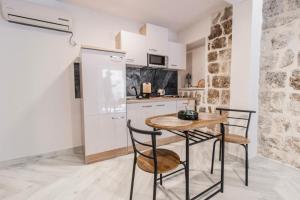 Kuchyň nebo kuchyňský kout v ubytování Apartments Florian