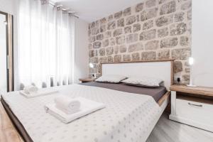 Postel nebo postele na pokoji v ubytování Apartments Florian
