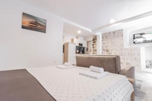Postel nebo postele na pokoji v ubytování Apartments Florian