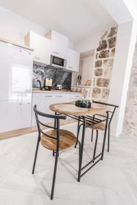 Kuchyň nebo kuchyňský kout v ubytování Apartments Florian