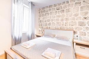 Postel nebo postele na pokoji v ubytování Apartments Florian