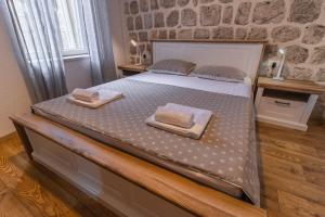 Postel nebo postele na pokoji v ubytování Apartments Florian