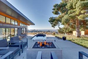 a patio with a fire pit in the middle at Luxe, Modern Studio with Sweeping City Views! in Boise