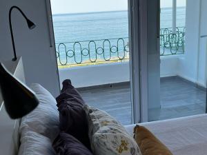a room with a window with a view of the ocean at Casa Blanca in Torrox Costa