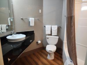 a small bathroom with a toilet and a sink at Motel 6-Biloxi, MS - Beach in Biloxi