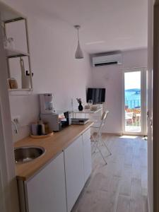a kitchen with a sink and a counter top at Ida view in Hvar