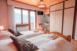Postel nebo postele na pokoji v ubytování Relais Fleuri