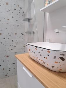 a bathroom with a bowl sink on a counter at Ida view in Hvar +6 photos