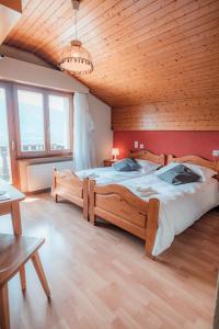 Postel nebo postele na pokoji v ubytování Relais Fleuri
