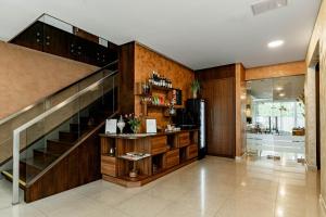 a lobby with a staircase and a wine cellar at NEW Rixwell Collection Seaside Hotel Jurmala in Jūrmala