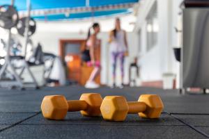 a group of orange skateboards sitting on the floor at HOTEL ALTAMIRA SUITES in Caracas