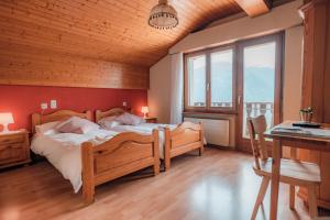 Postel nebo postele na pokoji v ubytování Relais Fleuri