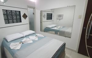 Postel nebo postele na pokoji v ubytování APARTAMENTO ACONCHEGANTE NO CENTRO de Petrolina todo CLIMATIZADO com 4 quartos área gourmet e Wi-fi 300MB