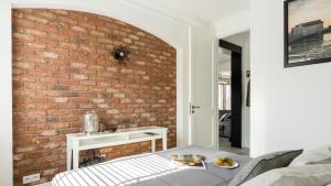 Posteľ alebo postele v izbe v ubytovaní Apartament Ap94