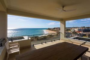a balcony with a view of the ocean at Seascape Christies Ocean Views in Christies Beach