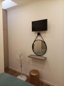 TV a/nebo společenská místnost v ubytování HOSPEDARIA LONDRES + 44 fotografií