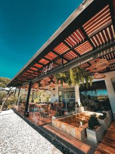 a building with a patio with a table and chairs at Arvum Hotel Boutique in Guatapé