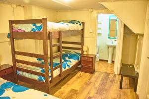 Postel nebo postele na pokoji v ubytování Hostal Triwe