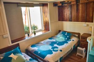 Postel nebo postele na pokoji v ubytování Hostal Triwe