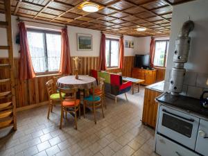 a kitchen and dining room with a table and chairs at holiday home in Bohemia in the Czech Republic in Svinařov