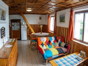 a living room with a couch and a table at holiday home in Bohemia in the Czech Republic in Svinařov