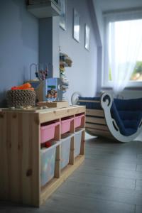 a childs room with a table and a chair at Family Apartment - Centrum in Kudowa-Zdrój