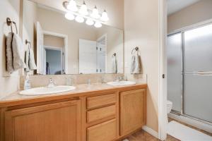 a bathroom with two sinks and a large mirror at Near Tamarack AC Kitchen TV Washer Dryer in Donnelly +38 photos